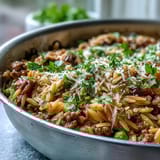 Forkful of savory Comforting Ground Beef Orzo Dinner with melted Parmesan and tender orzo.