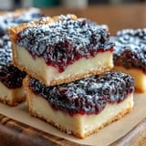 Delicious blackberry lemon bars swirled with tangy lemon filling, perfect for dessert.