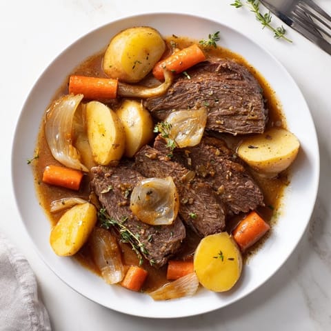 Hearty Beef Pot Roast plated with vegetables, ready for a comforting family dinner.