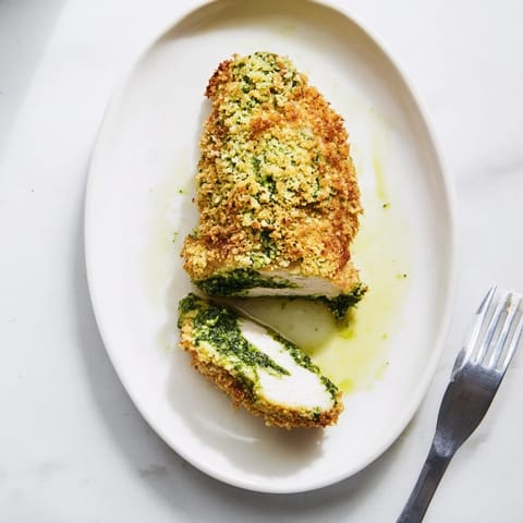 Golden-baked Mozzarella & Pesto Stuffed Chicken breasts oozing with melted cheese and fresh basil.